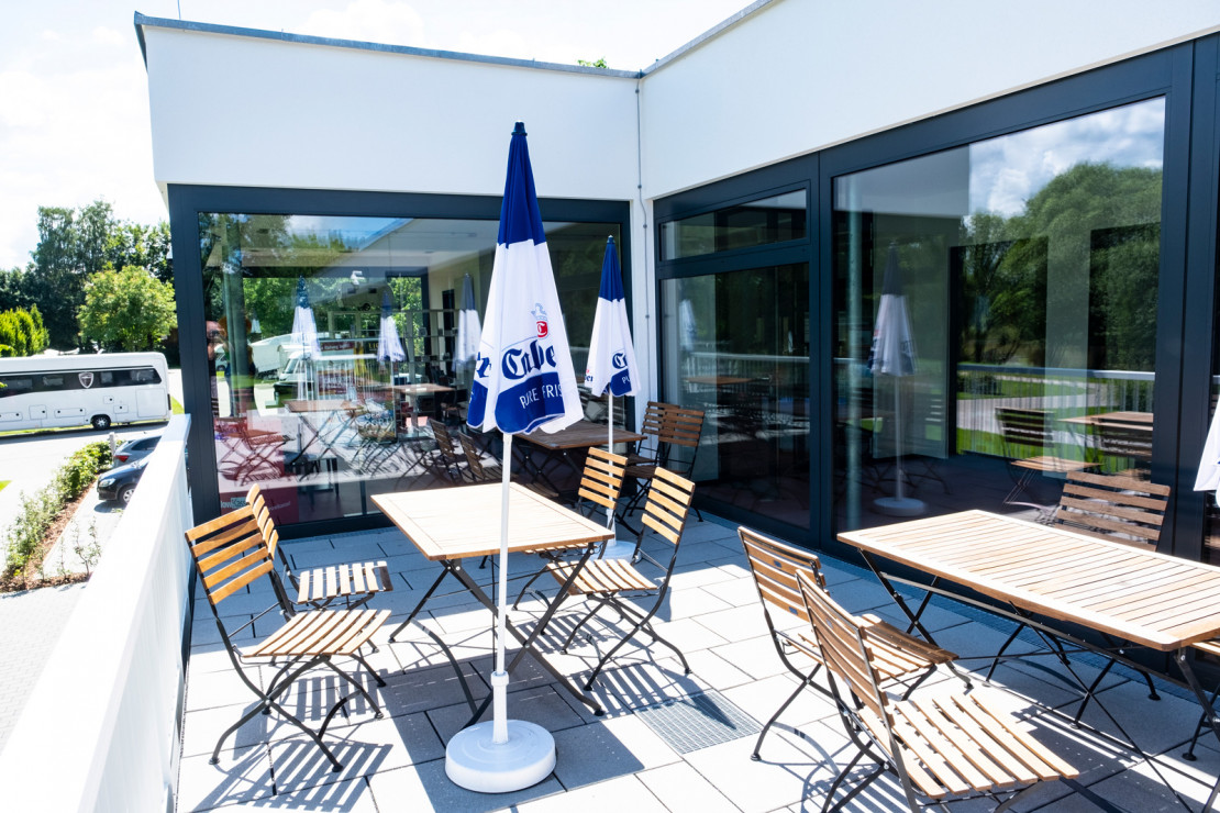 Seating for relaxing on the terrace area of ​​the bistro on the campsite