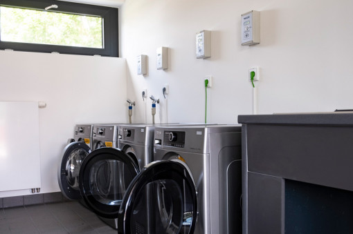 Modern washing machines and dryers in the functional building of the Kassel campsite