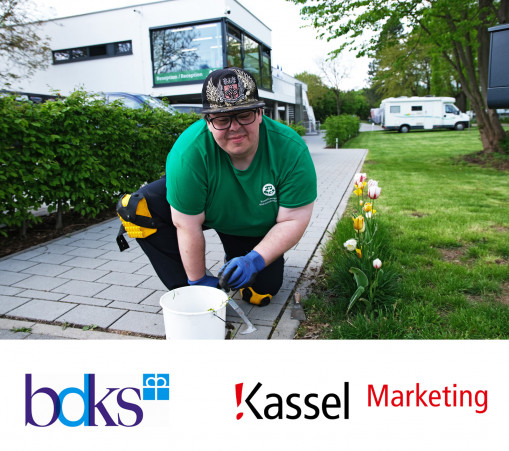 As part of the inclusion project, an employee with a disability takes care of the plants and lawn.