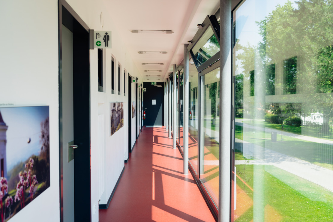 Corridor of the functional building to the showers and sanitary facilities