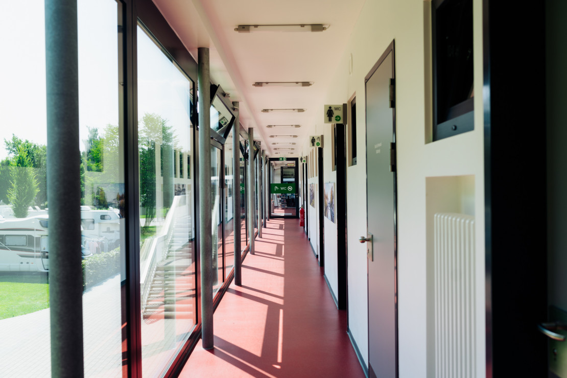 Corridor of the functional building towards the entrance area and bistro