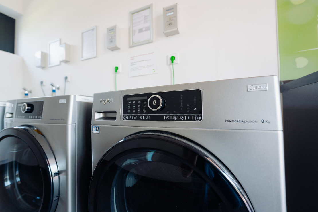 Detailed view of a washing machine in the functional building of the Kassel campsite